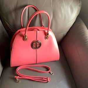 Beautiful salmon coloured patent leather purse with gold hardware.